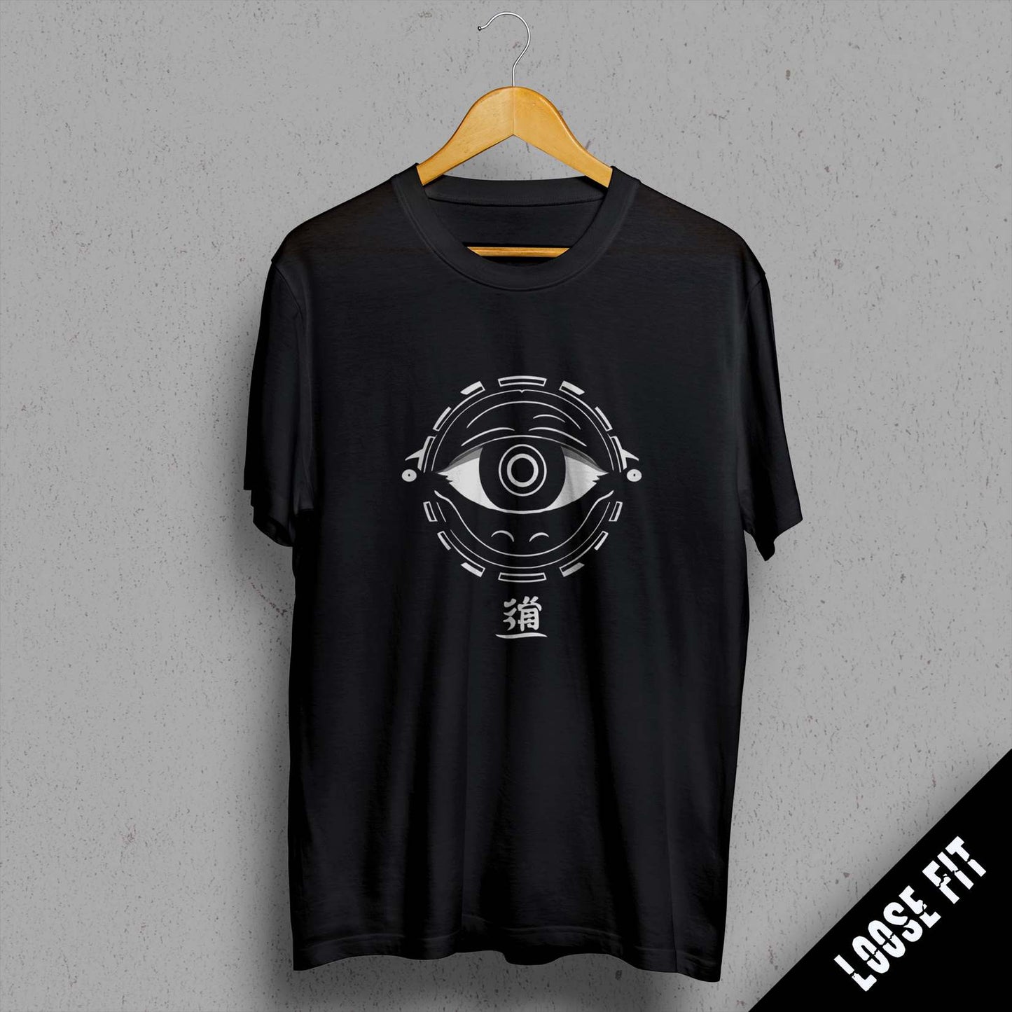 a black t - shirt with an eye on it