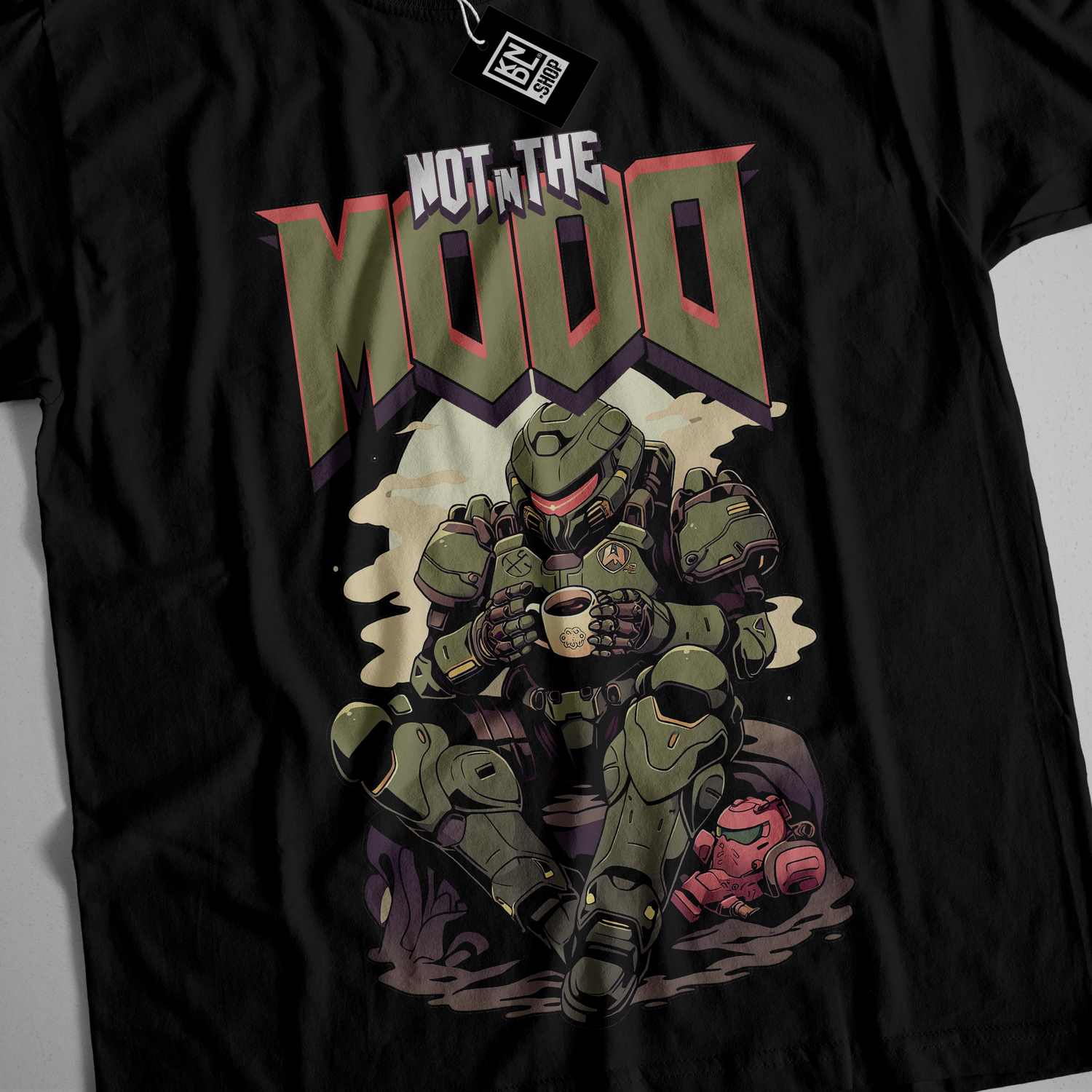 a black t - shirt with a picture of a man sitting on a rock