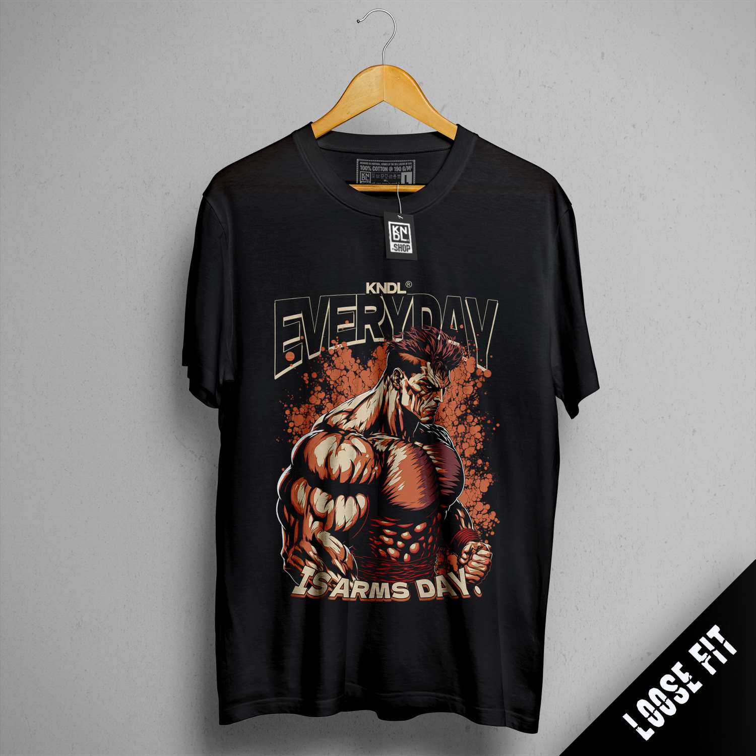 a black t - shirt with a picture of a muscular man on it