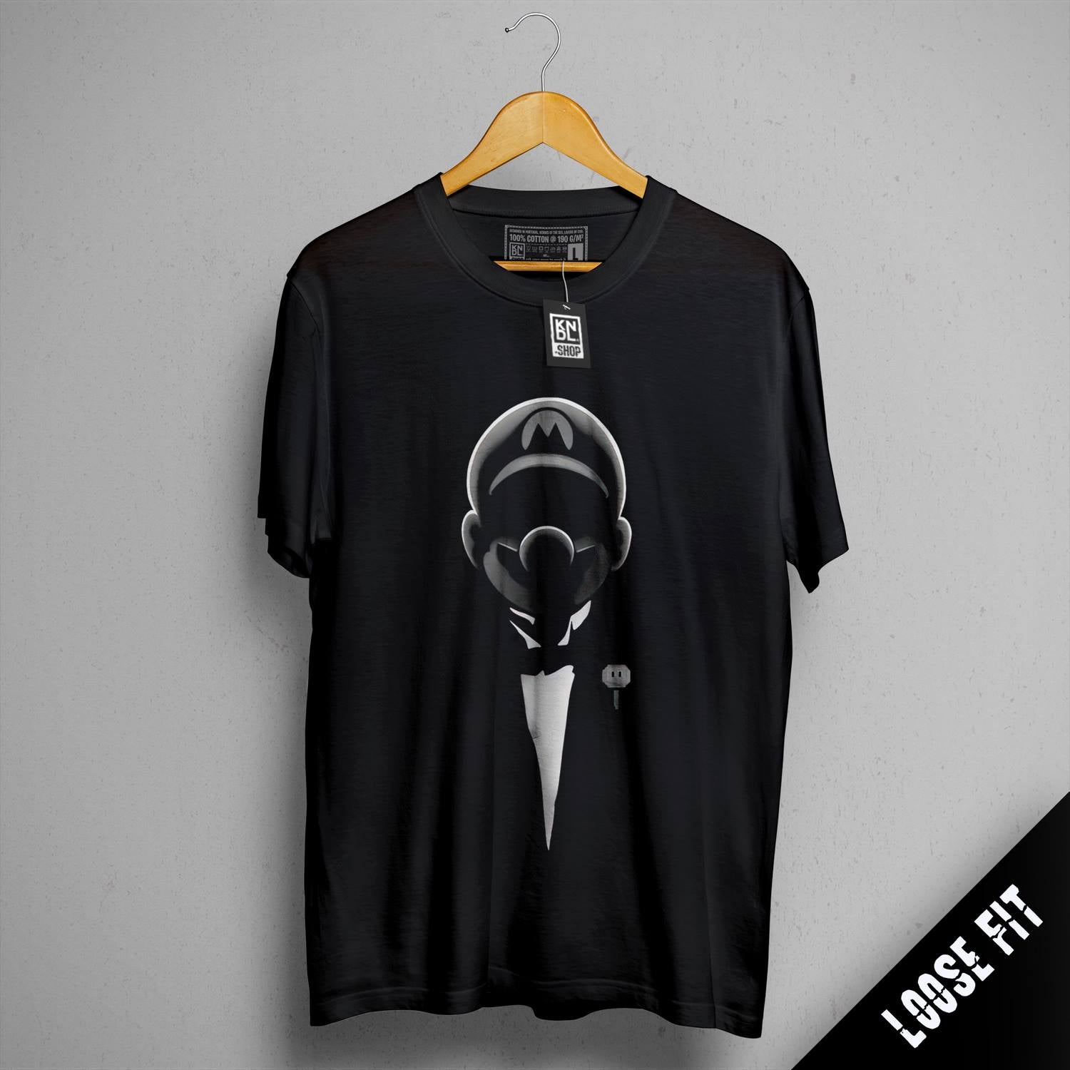 a black t - shirt with a picture of a man in a tuxedo