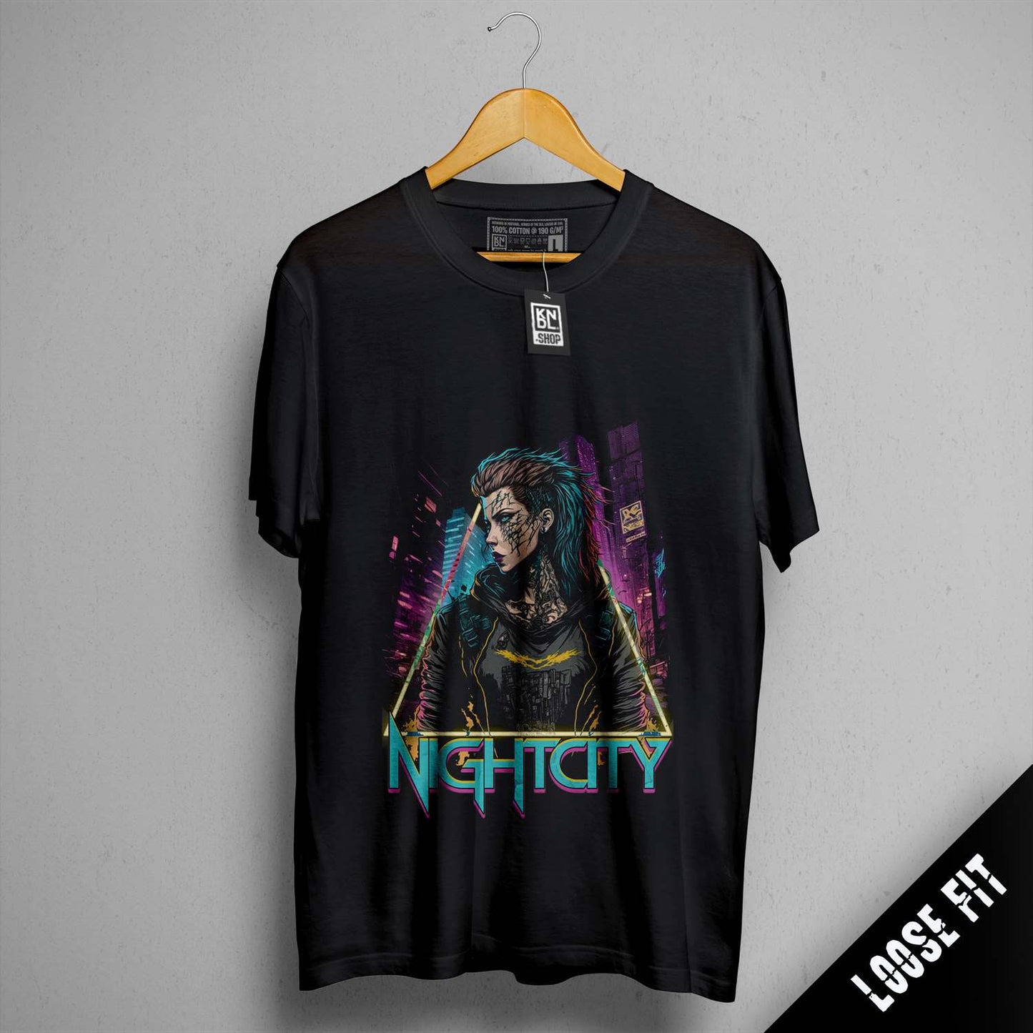 a black t - shirt with a picture of a woman holding a gun