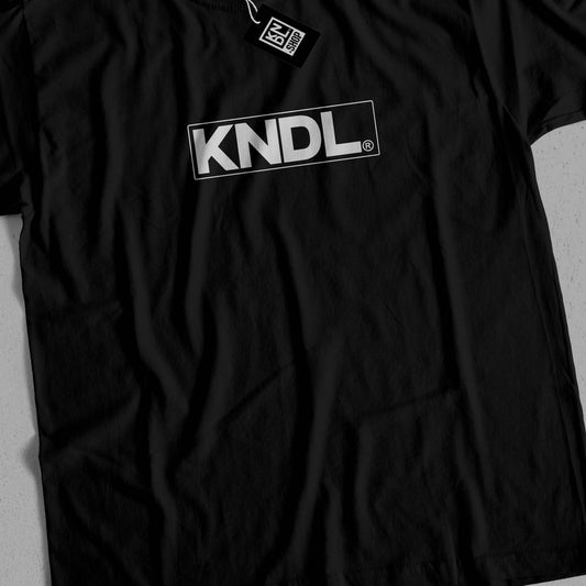 a black t - shirt with the word kindl printed on it