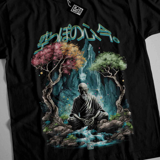 a black t - shirt with an image of a buddha sitting on a rock