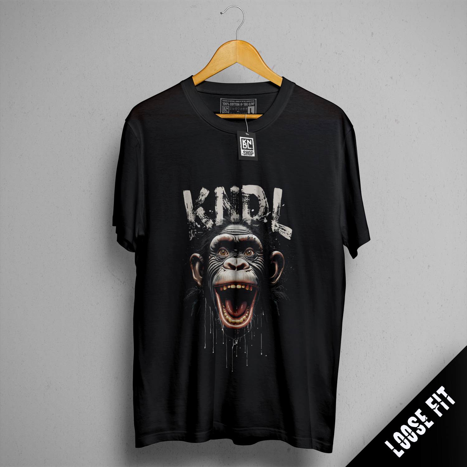 a black t - shirt with an image of a monkey on it