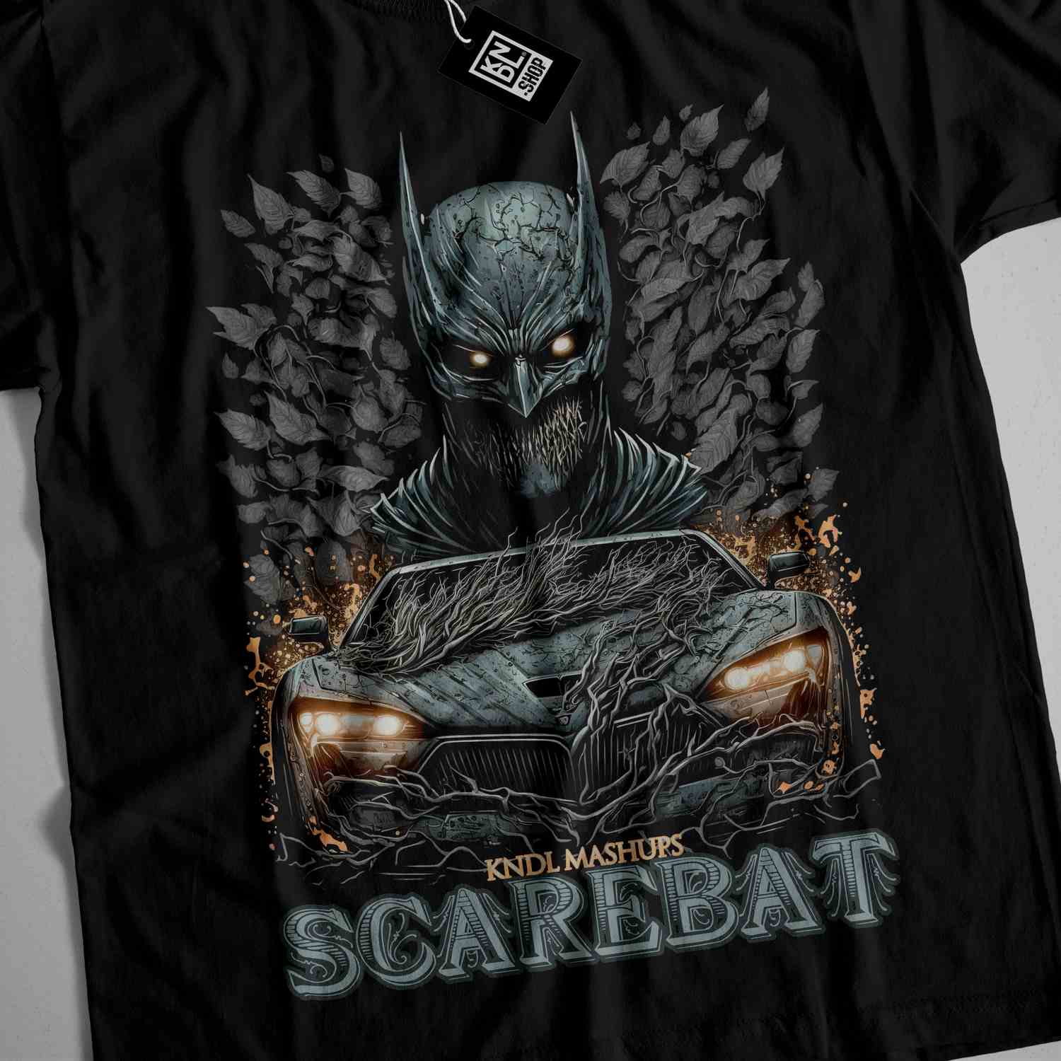 a black t - shirt with a picture of a car with a bat on it