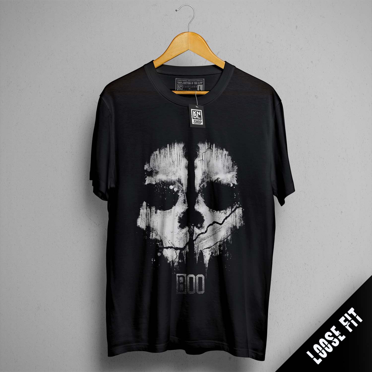 a black t - shirt with a white skull on it