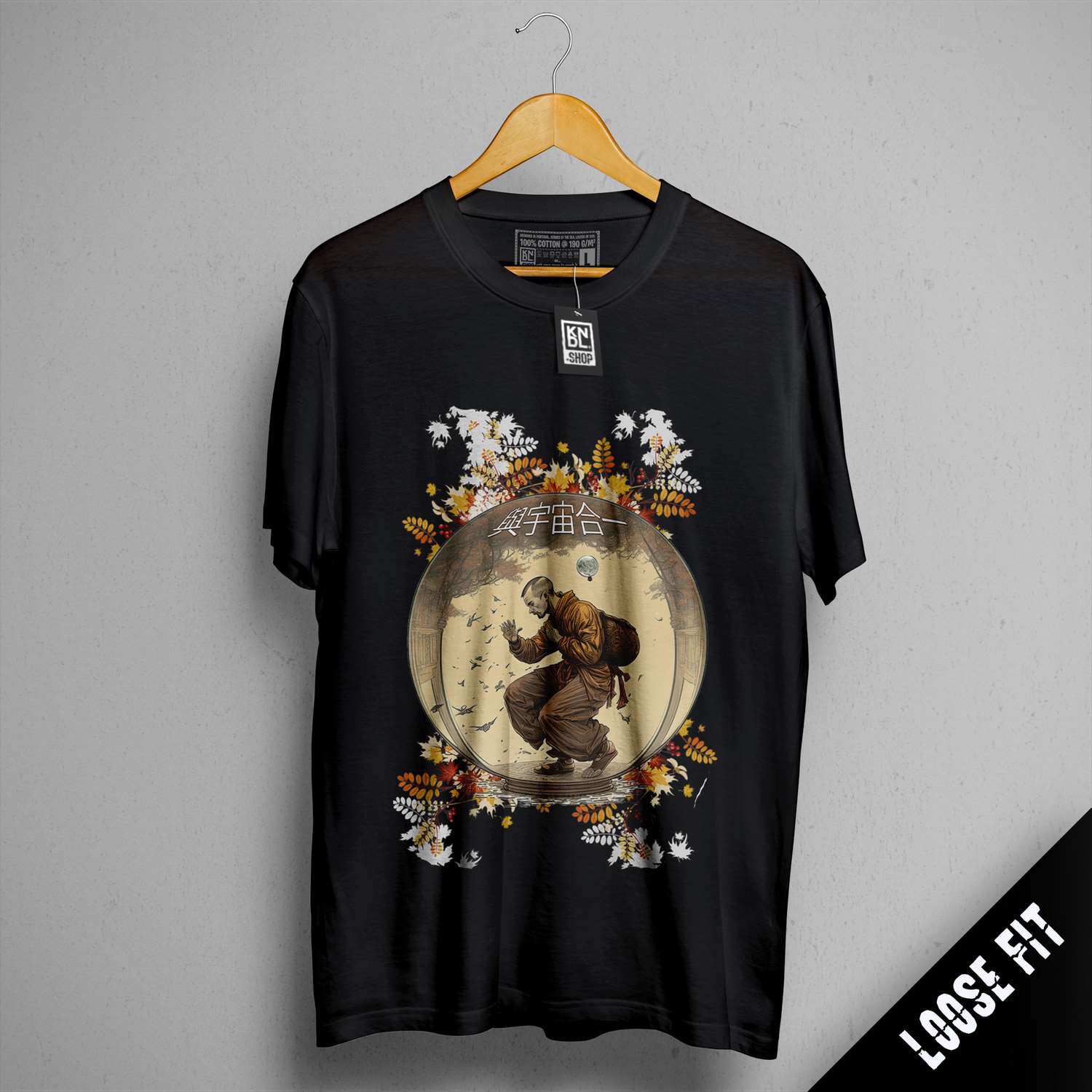 a black t - shirt with a picture of a bear on it