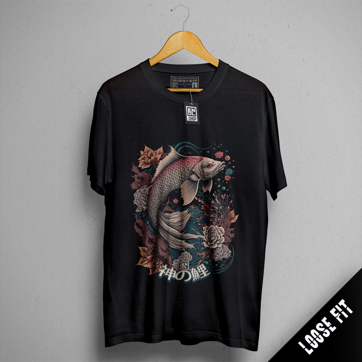 a black t - shirt with a koi fish on it