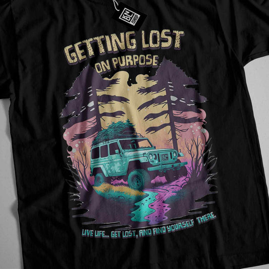 a black t - shirt with a jeep driving through a forest