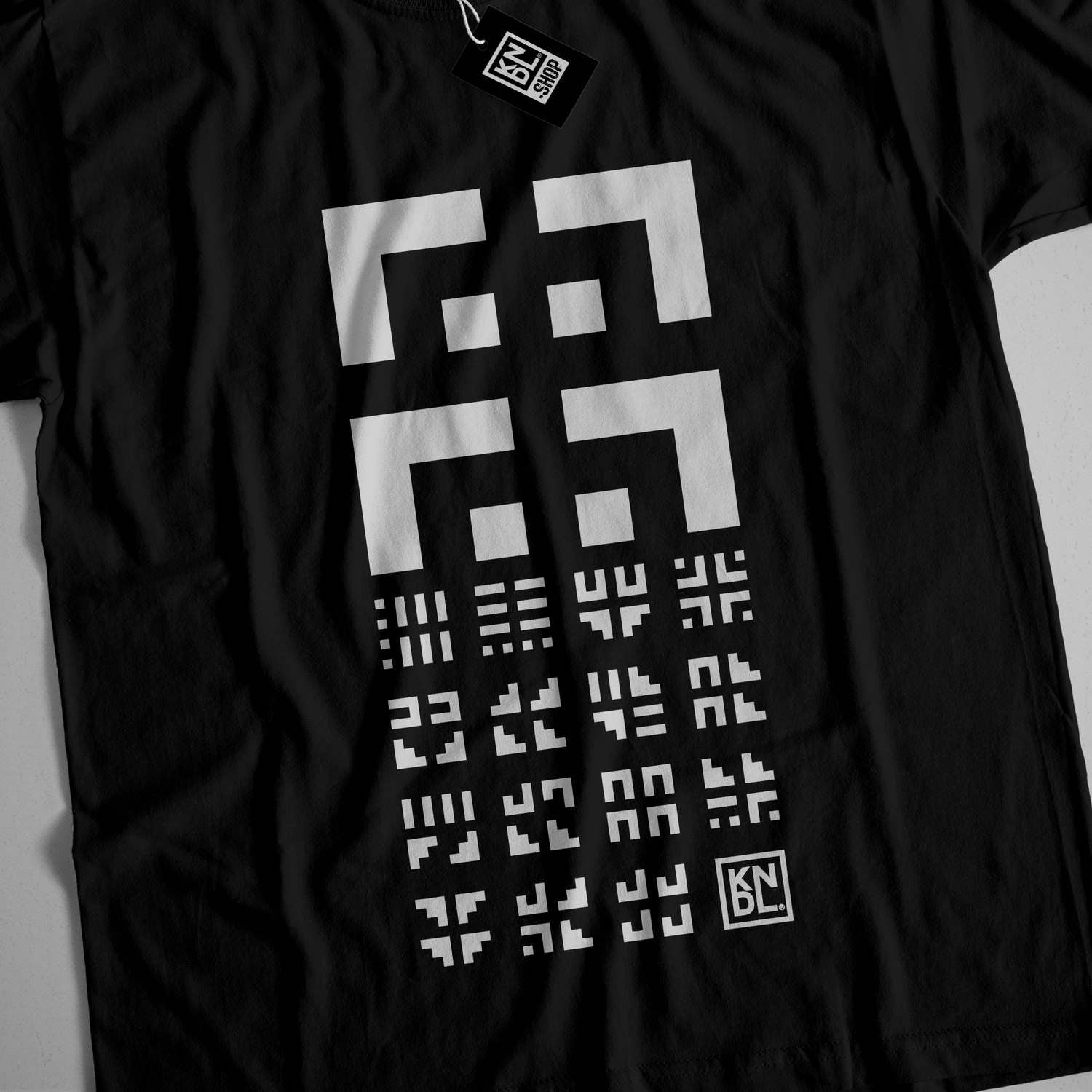 a black t - shirt with white numbers on it