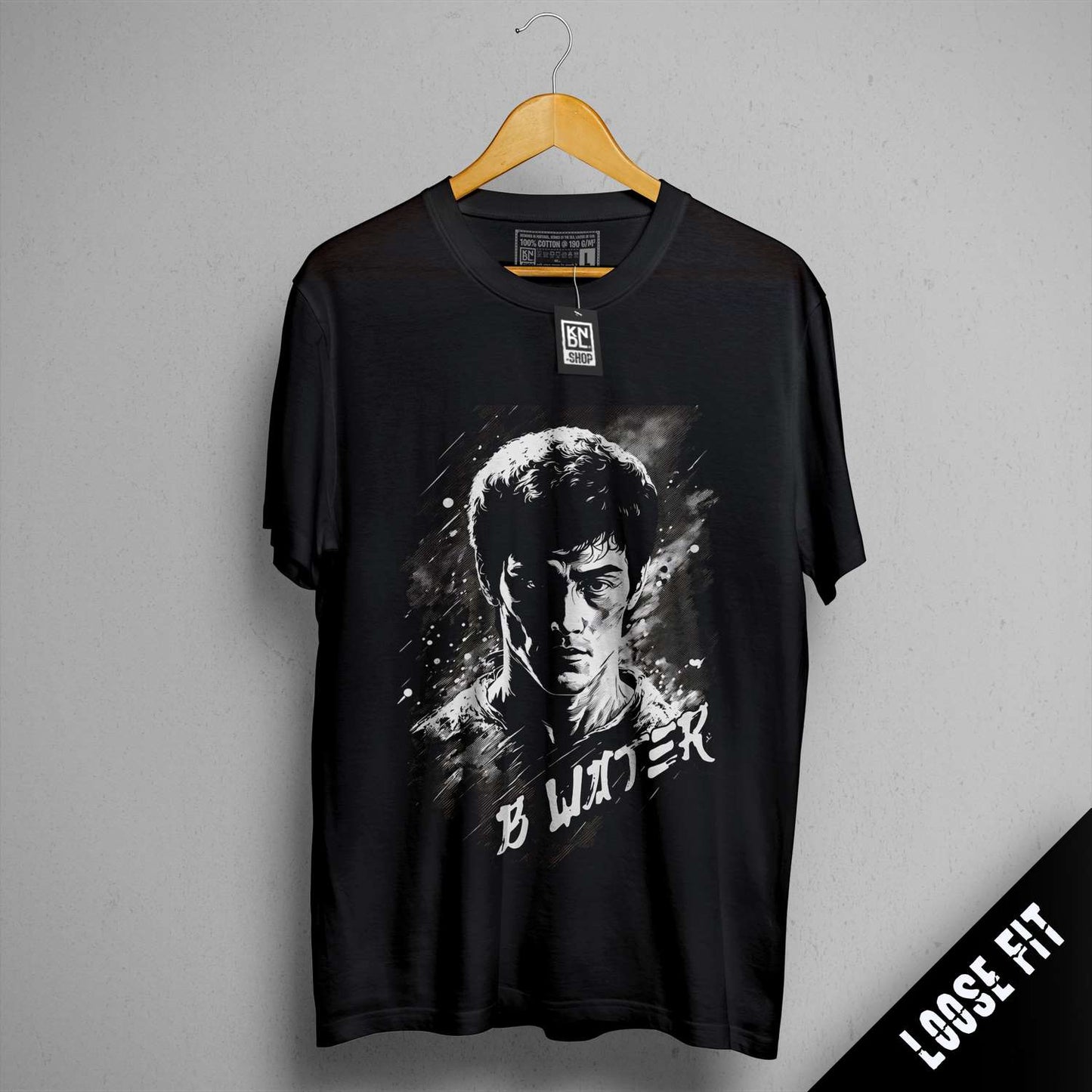 a black t - shirt with a picture of a man holding a gun